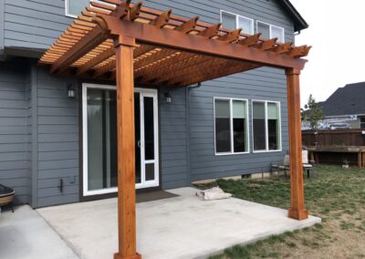 New pergola stained with semi-transparent exterior wood stain completed by Vancouver WA deck and pergola staining contractor.